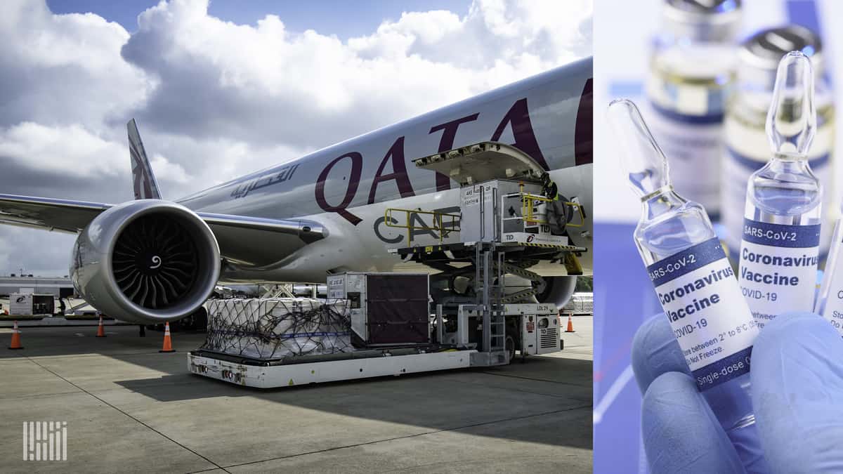 Light gray Qatar Airways cargo plane being loaded at airport from side door.