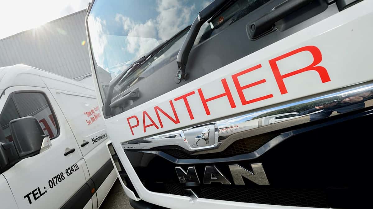 Delivery vehicles of Panther Logistics seen from the front. AIT Worldwide acquired Panther