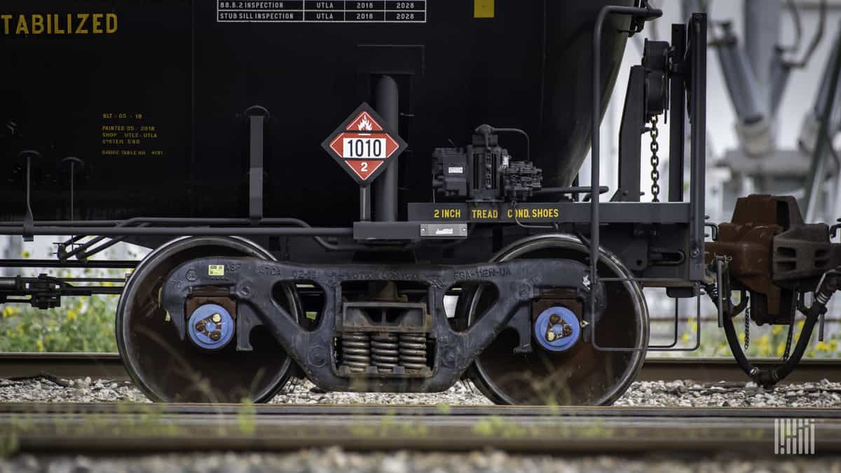 A photograph of a railcar's set of wheels.