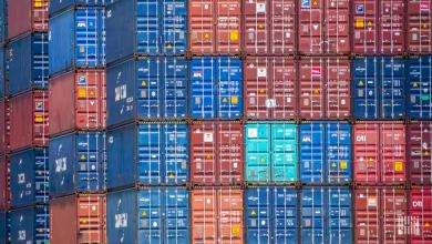 Shipping containers stacked at a port to illustrate Descartes Systems third quarter financial results