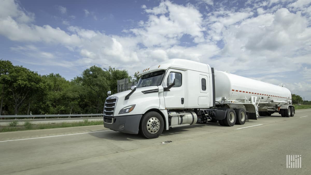 A white semi truck hauling a tanker trailer. Parkland Corp, major Canadian fuel distributor, was targeted in a cyberattack.