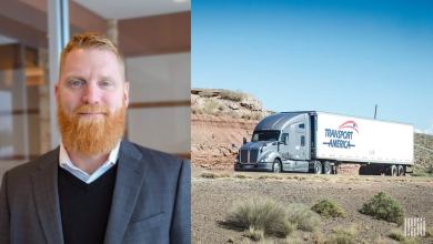 Transport America President Eric Anson shown next to a Transport America tractor trailer. The trucking company has been shifting its drivers to dedicated trucking services.