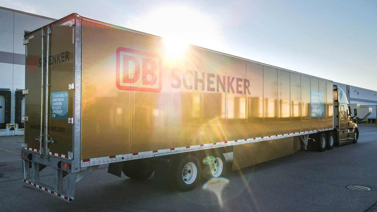 A gold-painted truck shining in the bright sun.