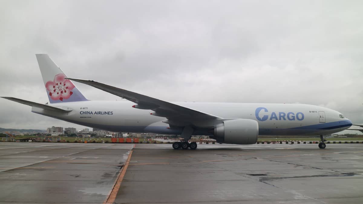 A side view of new China Airlines 777 on a gray day.