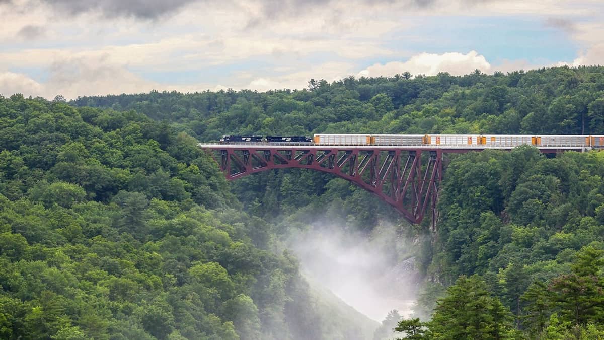 A photograph of a Norfolk Southern train crossing a bridge.