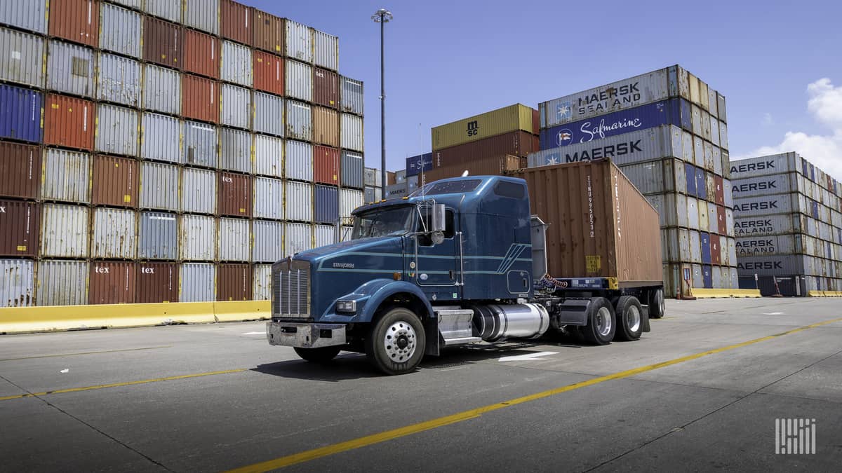 Truck picks up containers at port