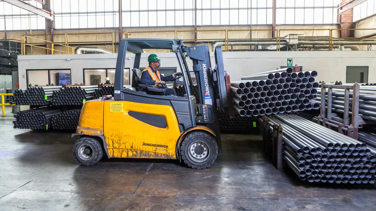 Fork truck operator inside warehouse