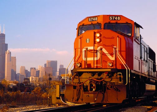 Canadian National Railway freight train with Chicago in the background.