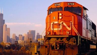 Canadian National Railway freight train with Chicago in the background.