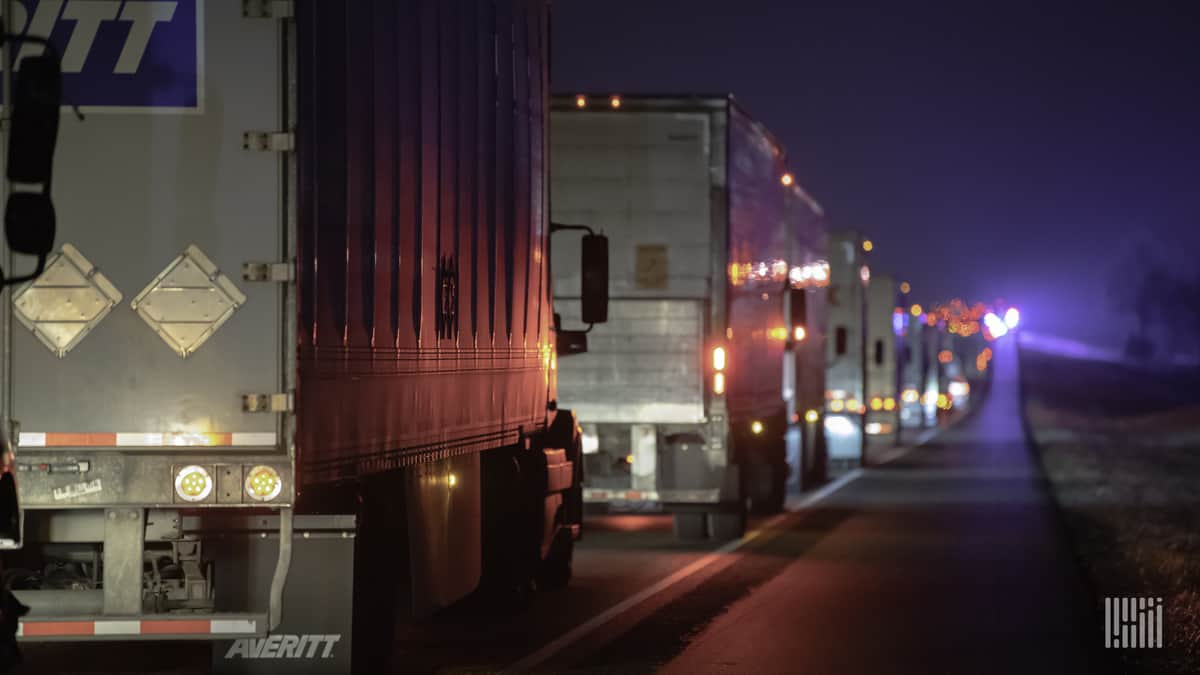 Tractor-trailers stuck in traffic on I-45 near Teague, Texas as road becomes icy on Feb. 13, 2021.