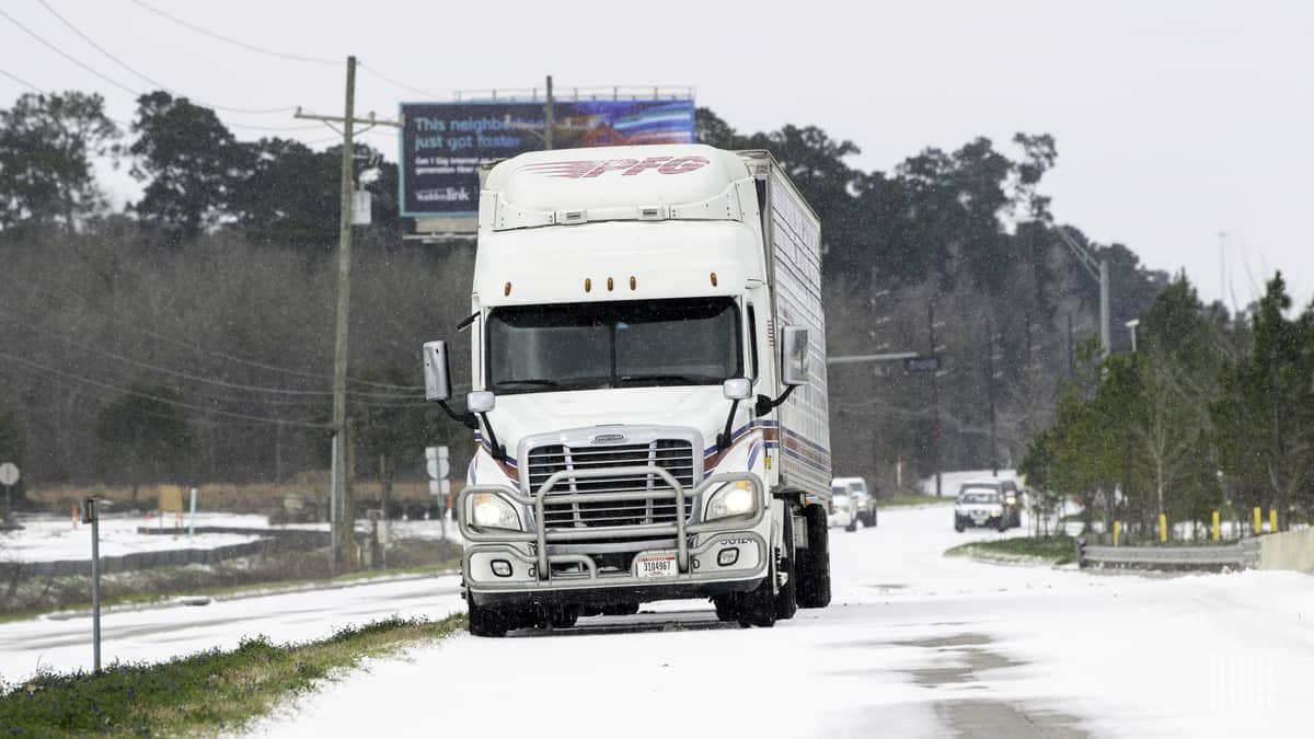 Tractor=trailer on snowy road in Texas, Feb. 15, 2021.