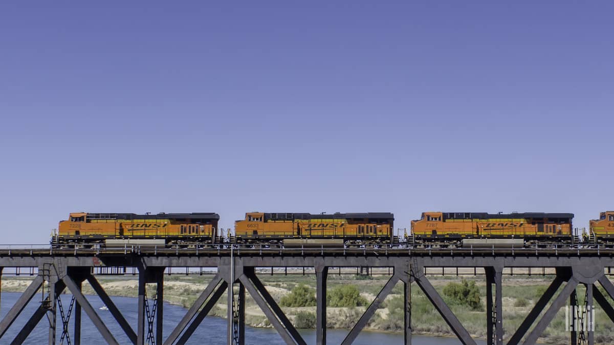 A photograph of BNSF locomotives crossing a bridge.