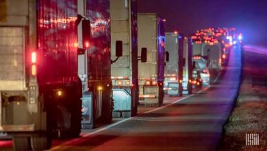 Trucks in highway traffic at night