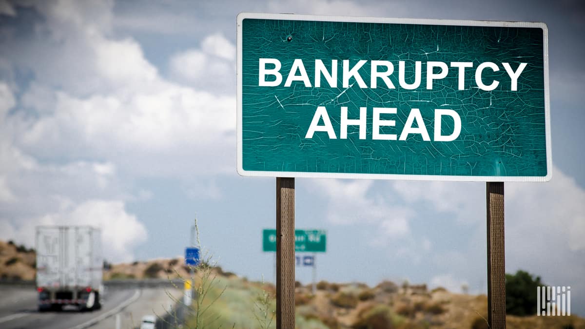 A road sign showing Bankruptcy Ahead to illustrate a story about a Michigan trucking company filing for Chapter 11 Bankruptcy.