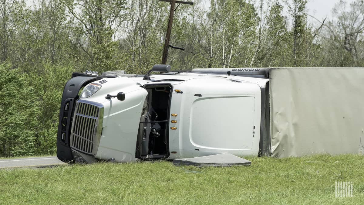 Tractor-trailer flipped on roadside.