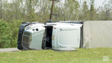 Tractor-trailer flipped on roadside.