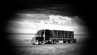 A tractor-trailer hauling oversized tires to illustrate an article about cargo theft.