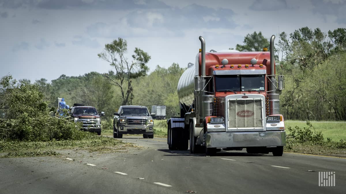 Trucker dodging downed trees and debris near Lake Charles, Louisiana after Hurricane Laura.