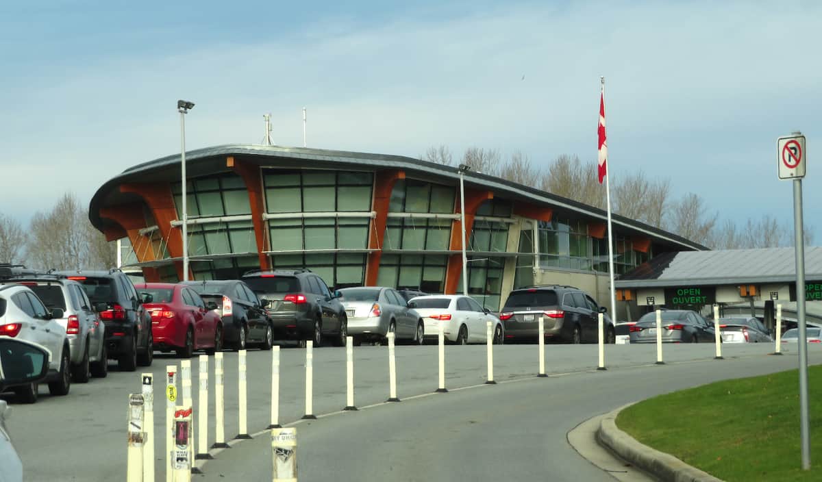 A view of cars lining of at the Watson US-Canada border crossing to illustrate an article about a trucker arrested on drug charges at that border crossing.