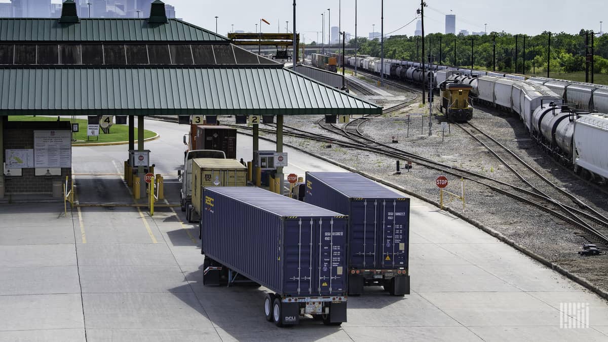 Trucking hauling intermodal containers to illustrate cybersecurity threats to the supply chain.