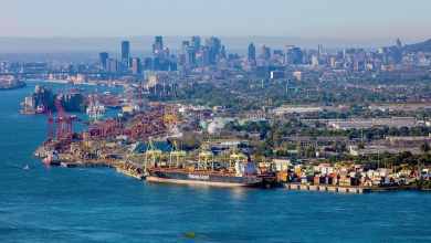 A few of the Port of Montreal and the city skyline behind it.