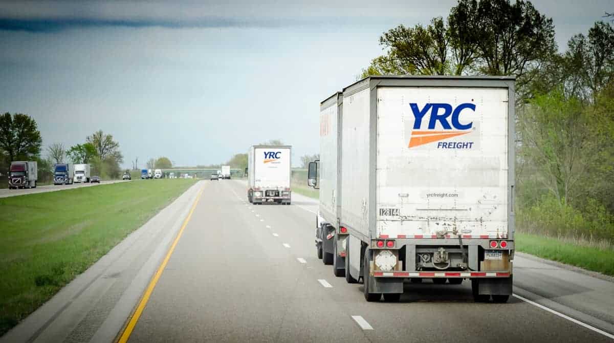 Two YRC-branded trucks move down the road. (Photo: Jim Allen/FreightWaves)