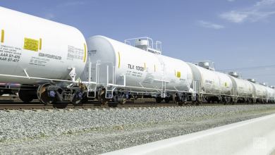A photograph of tank cars rolling down a railroad track.