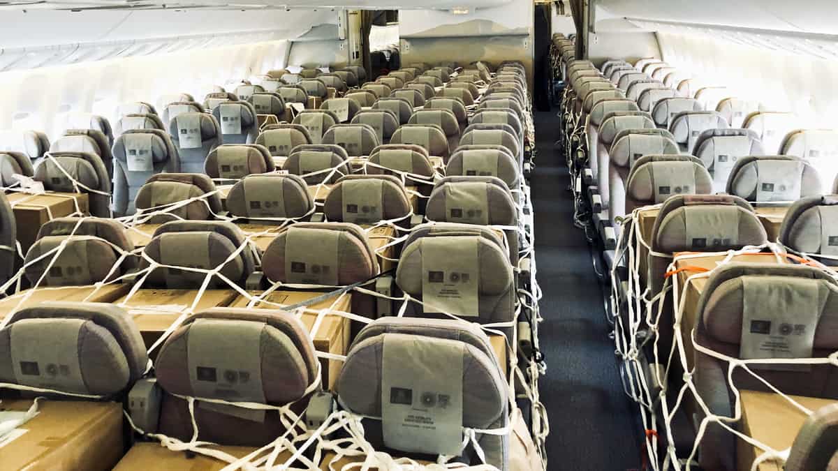 Boxes of cargo in a passenger cabin.