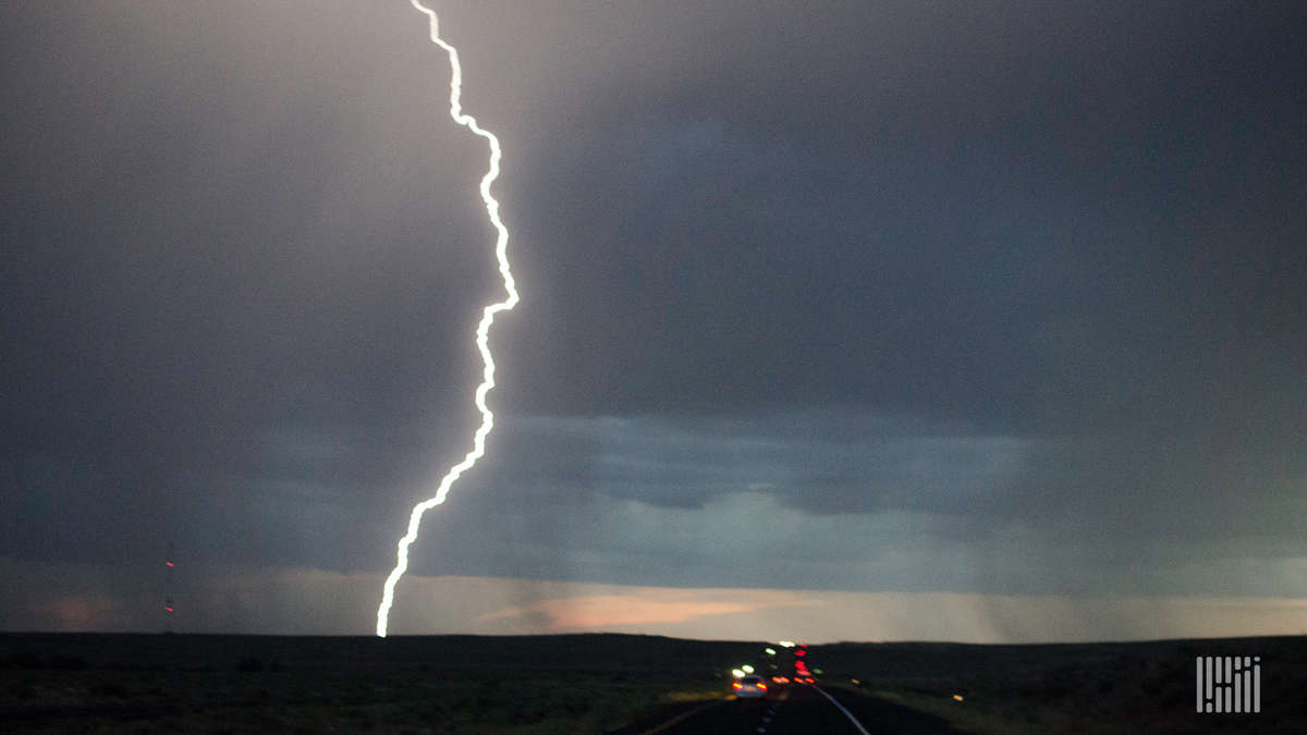 Lightning bolt coming down from a thunderstorm.