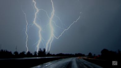 Multiple lightning strikes across a dark sky.