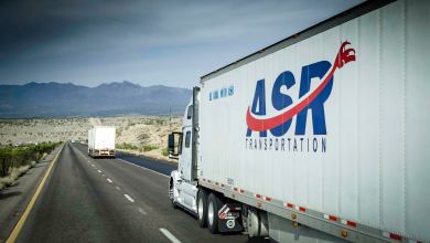 A tractor-trailer from ASR Transportation travels on a highway. The trucking company is part of legal dispute involving two brothers.