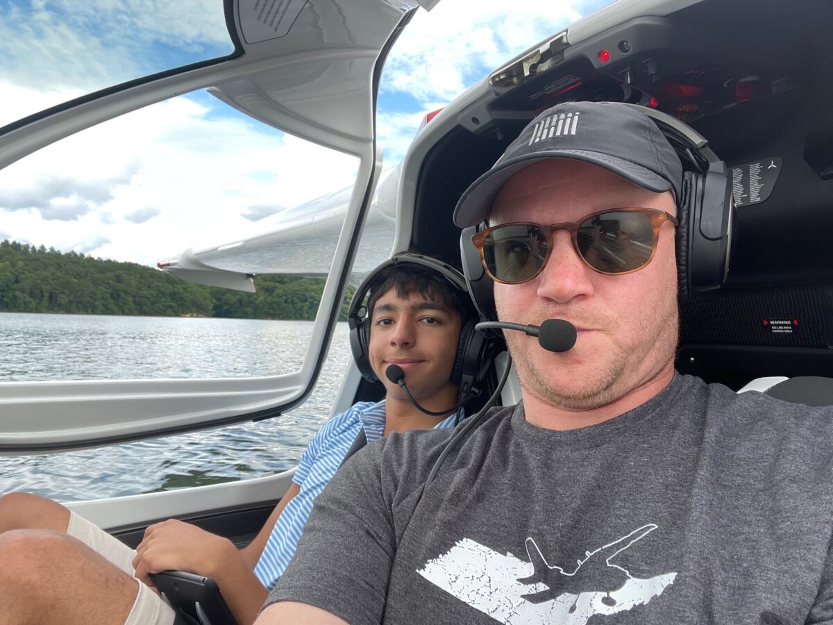 Craig Fuller with his son floating down the river in an ICON A5 floatplane