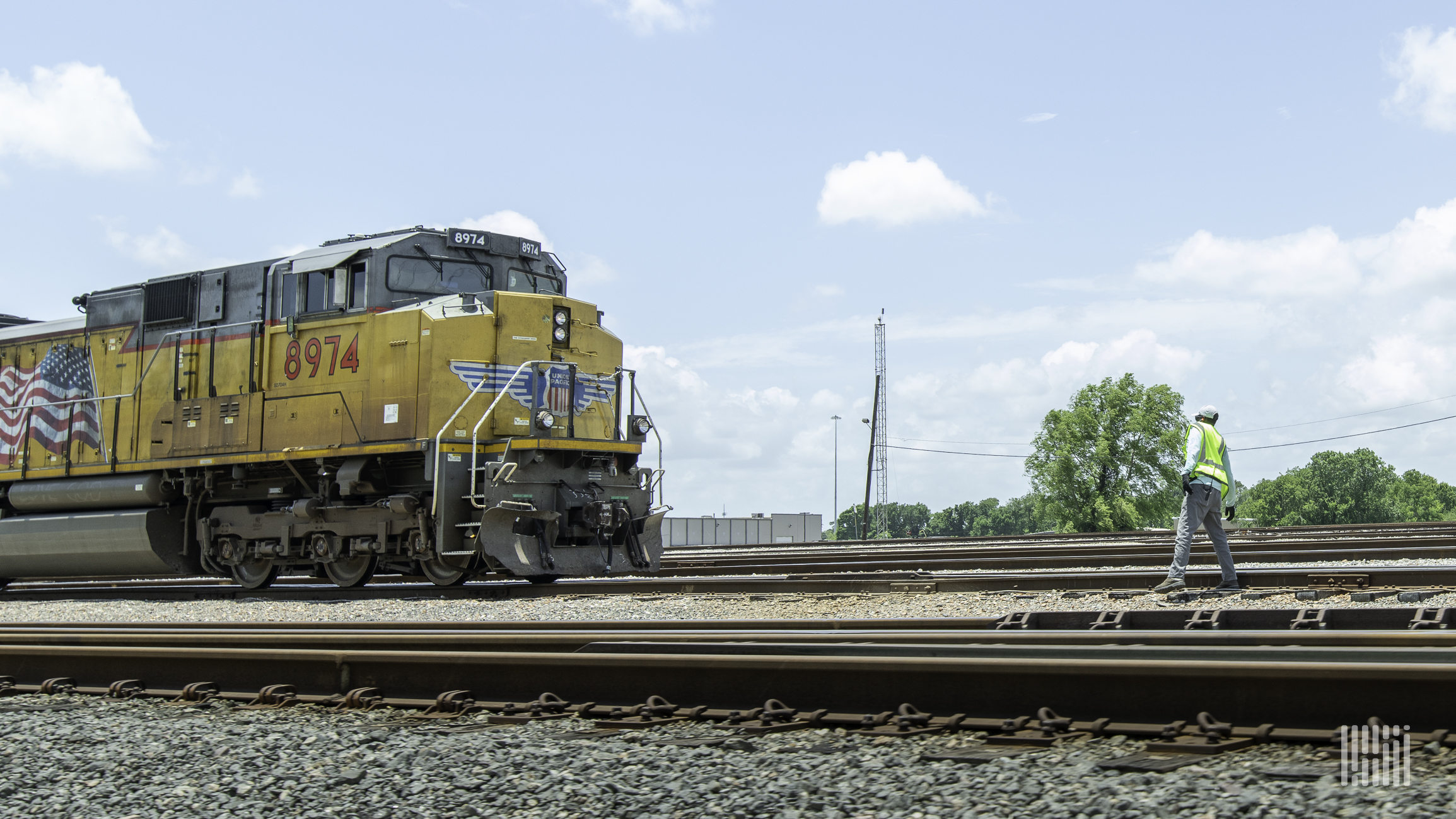 A photograph of a Union Pacific train on a train track.