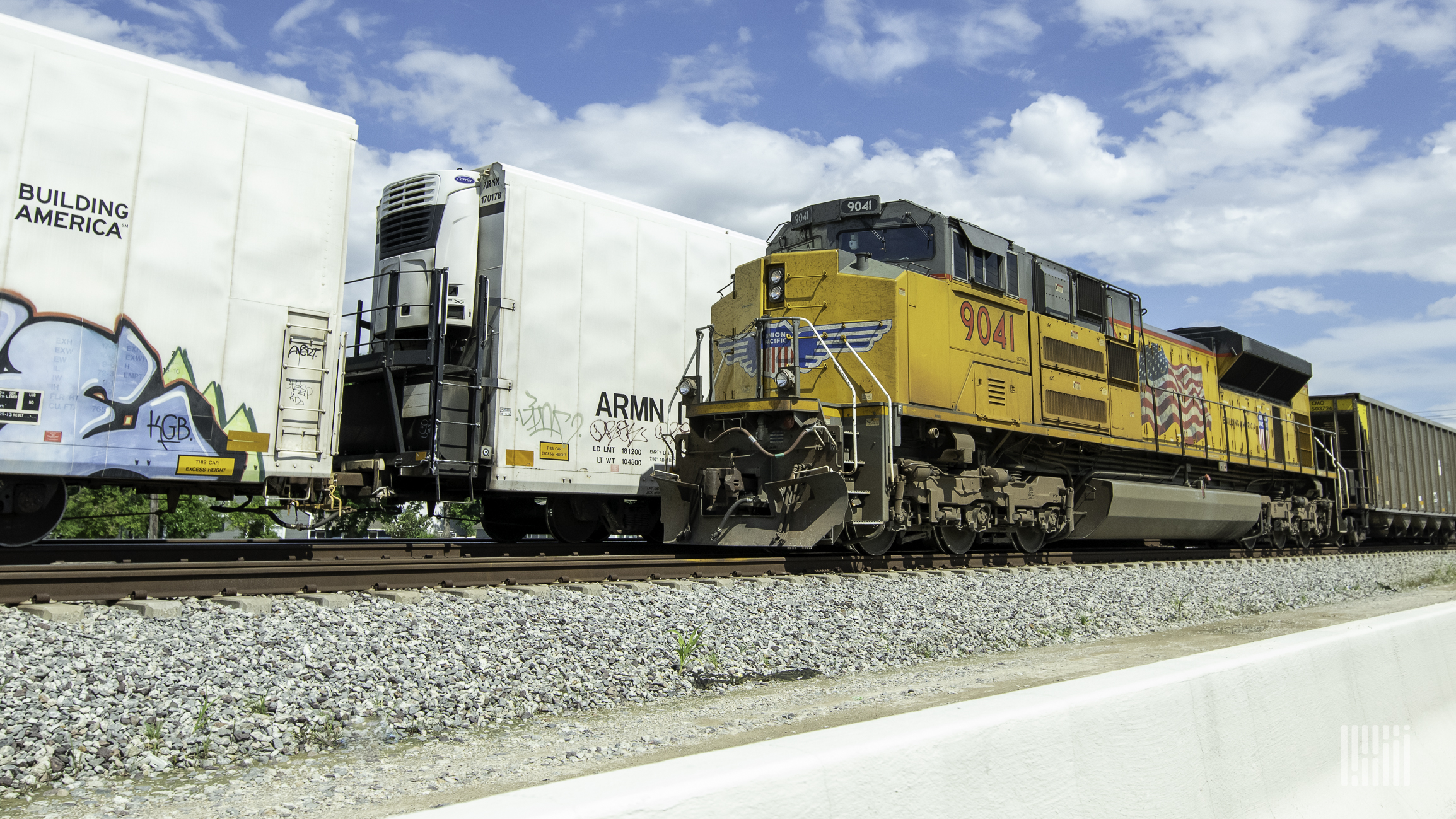 A photograph of a Union Pacific train on a train track.