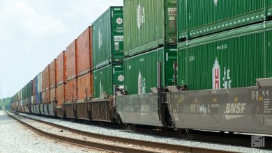 A photograph of a train hauling intermodal containers.