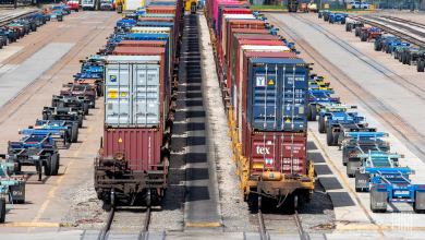 A photograph of containers and chassis parked in a rail yard.