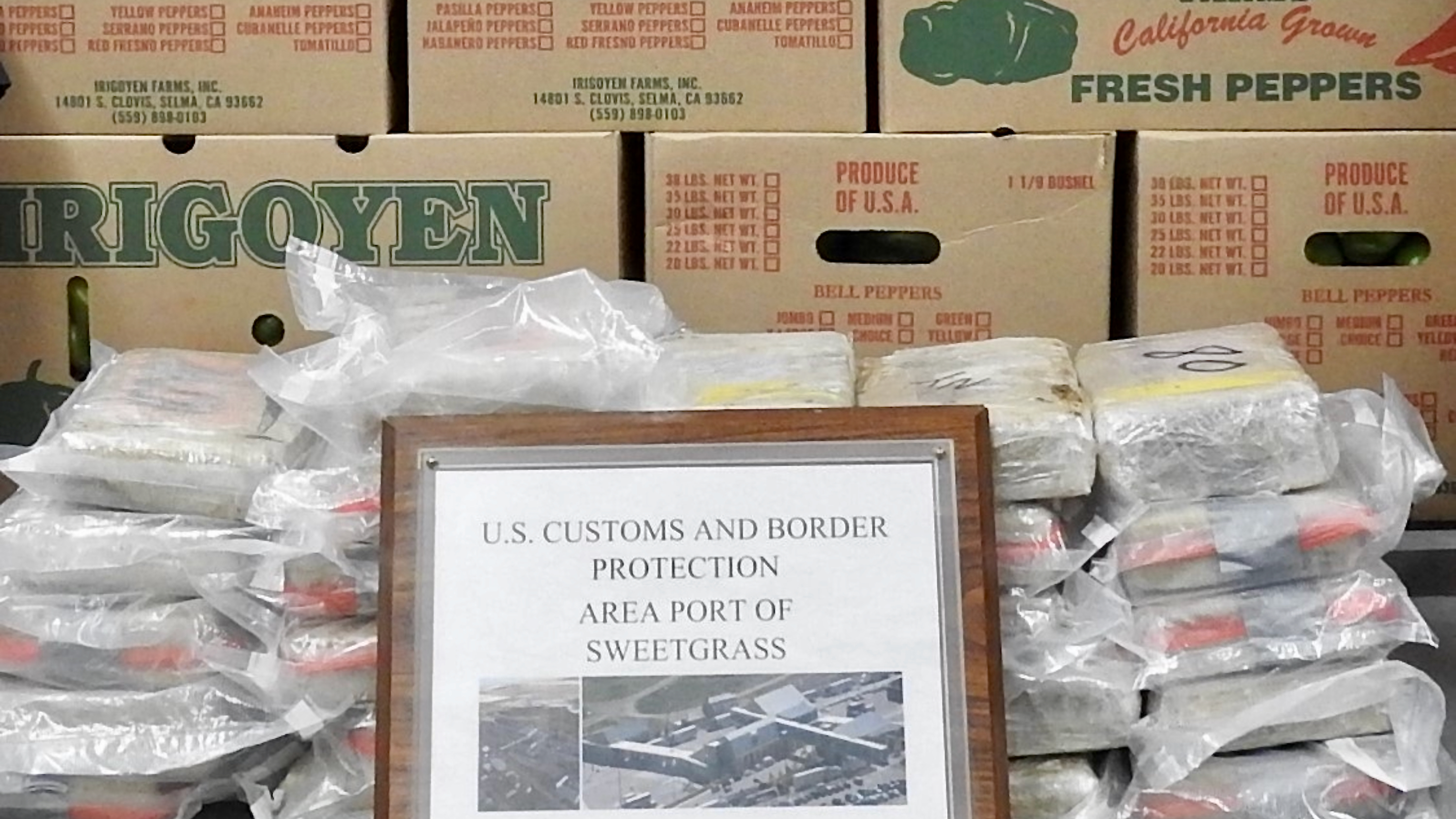 Bags of cocaine is displayed with boxes of produce seized by U.S. Customs and Border Protection officers at the Canadian border.
