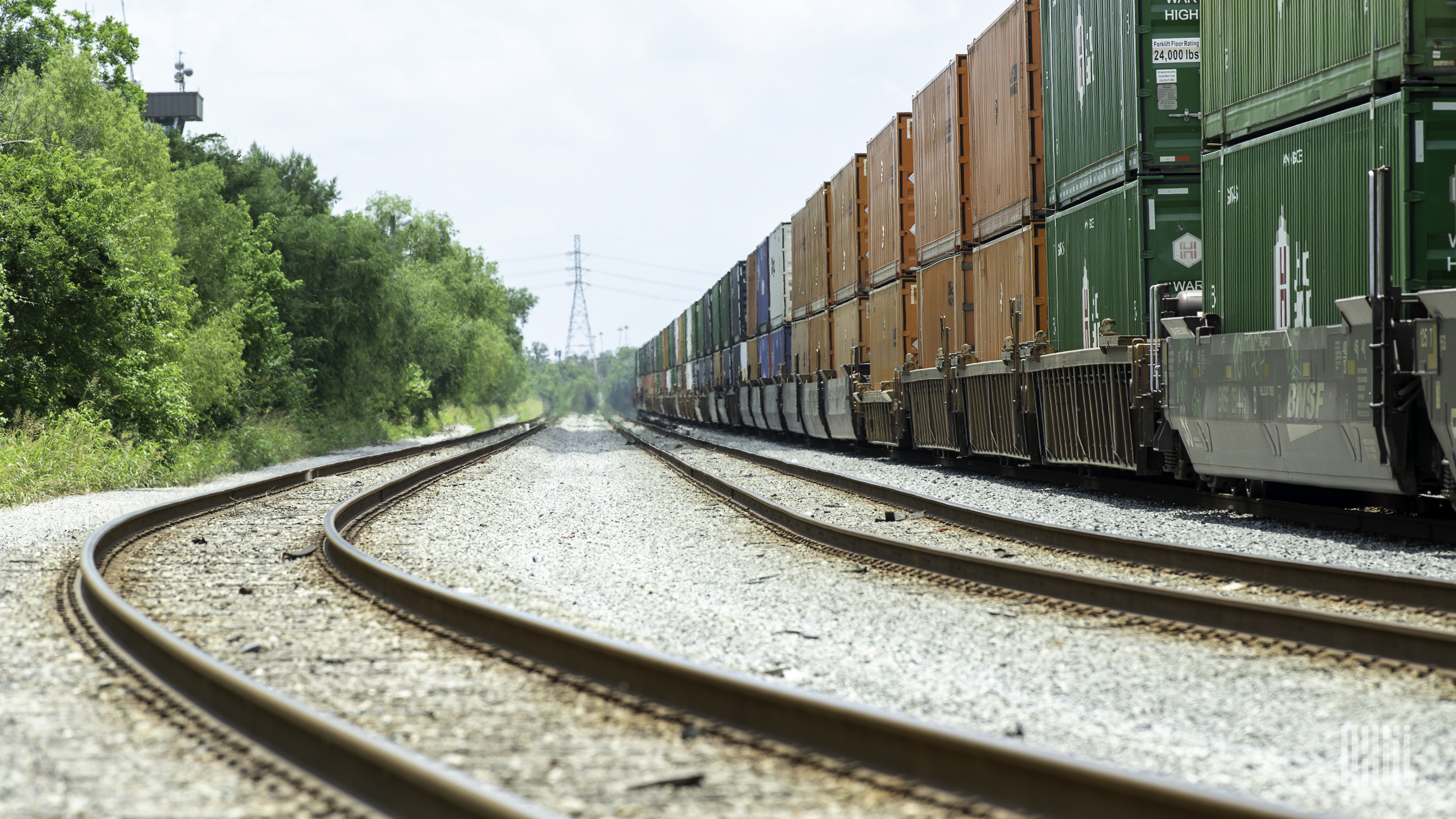 A photograph of a train hauling intermodal containers.