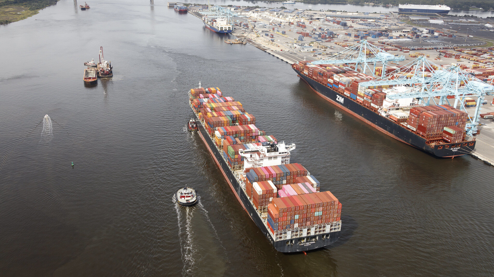 A photograph of two ocean vessels floating on a bay.