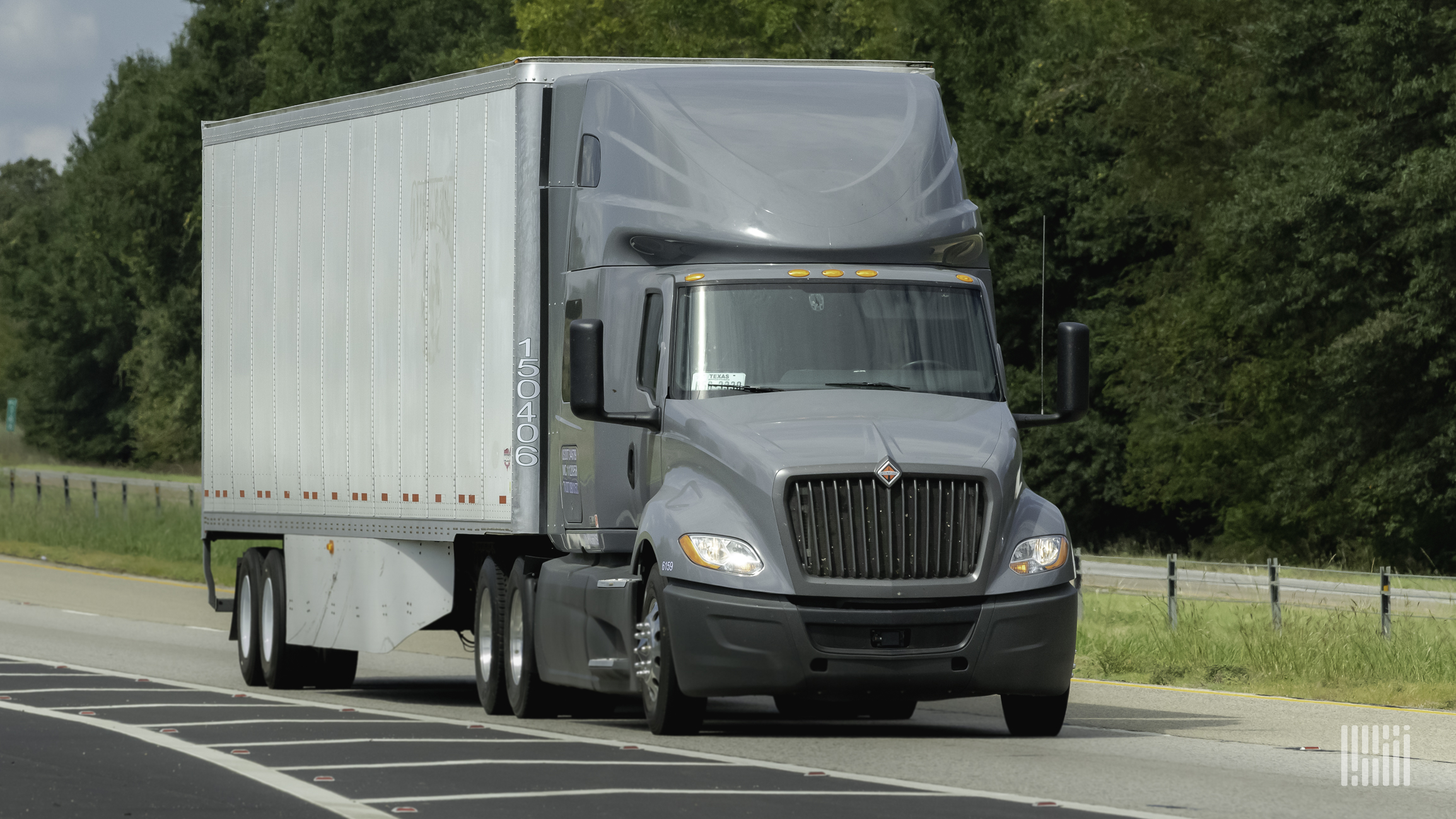 A Navistar International truck travels on a road, illustrating an article about a lawsuit over a data breach at the company.