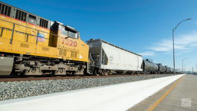 A photograph of a train parked in a rail yard.