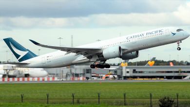A Cathay Pacific A350 passenger jet takes off.