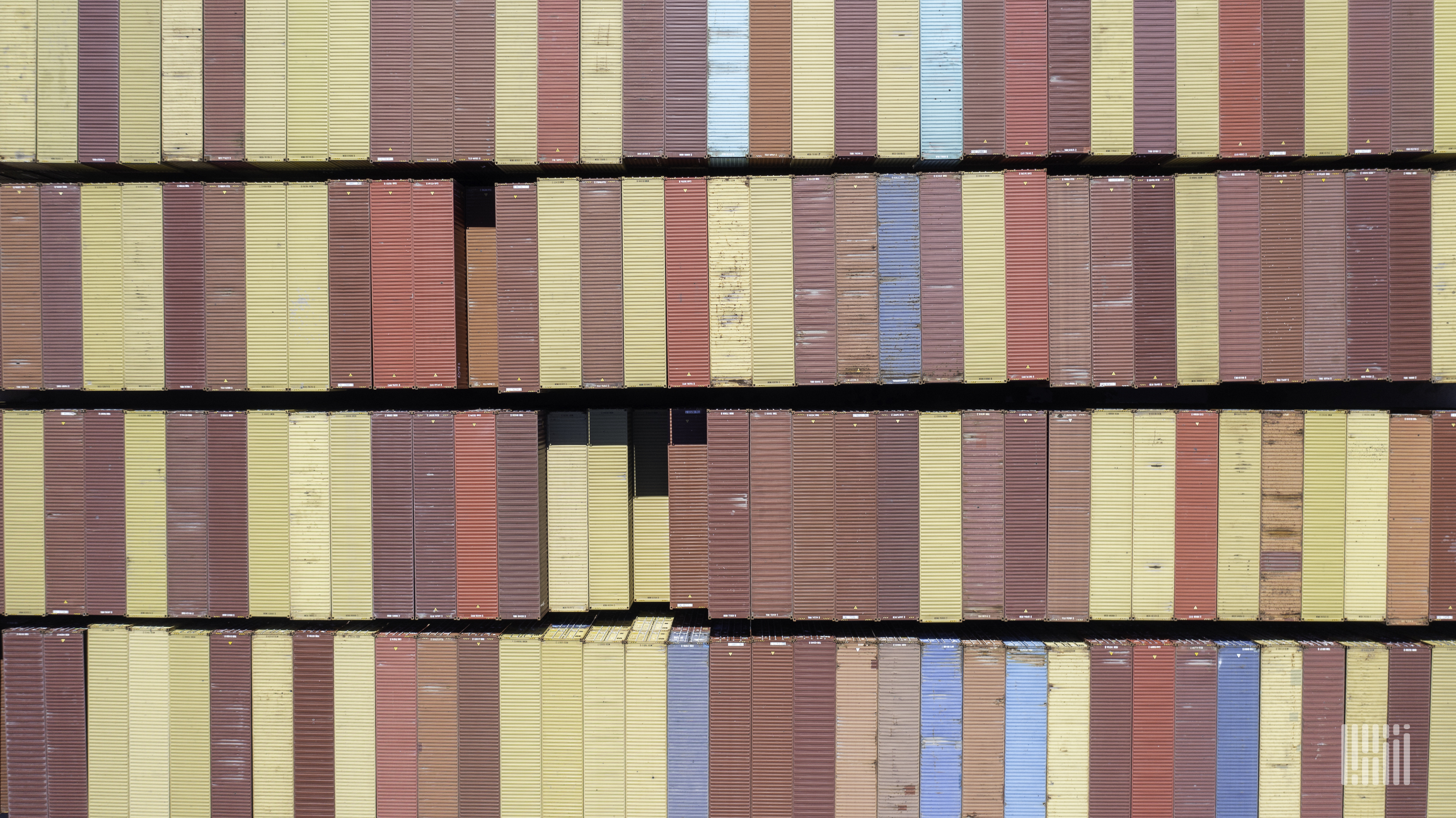 A photograph of rows of intermodal containers.