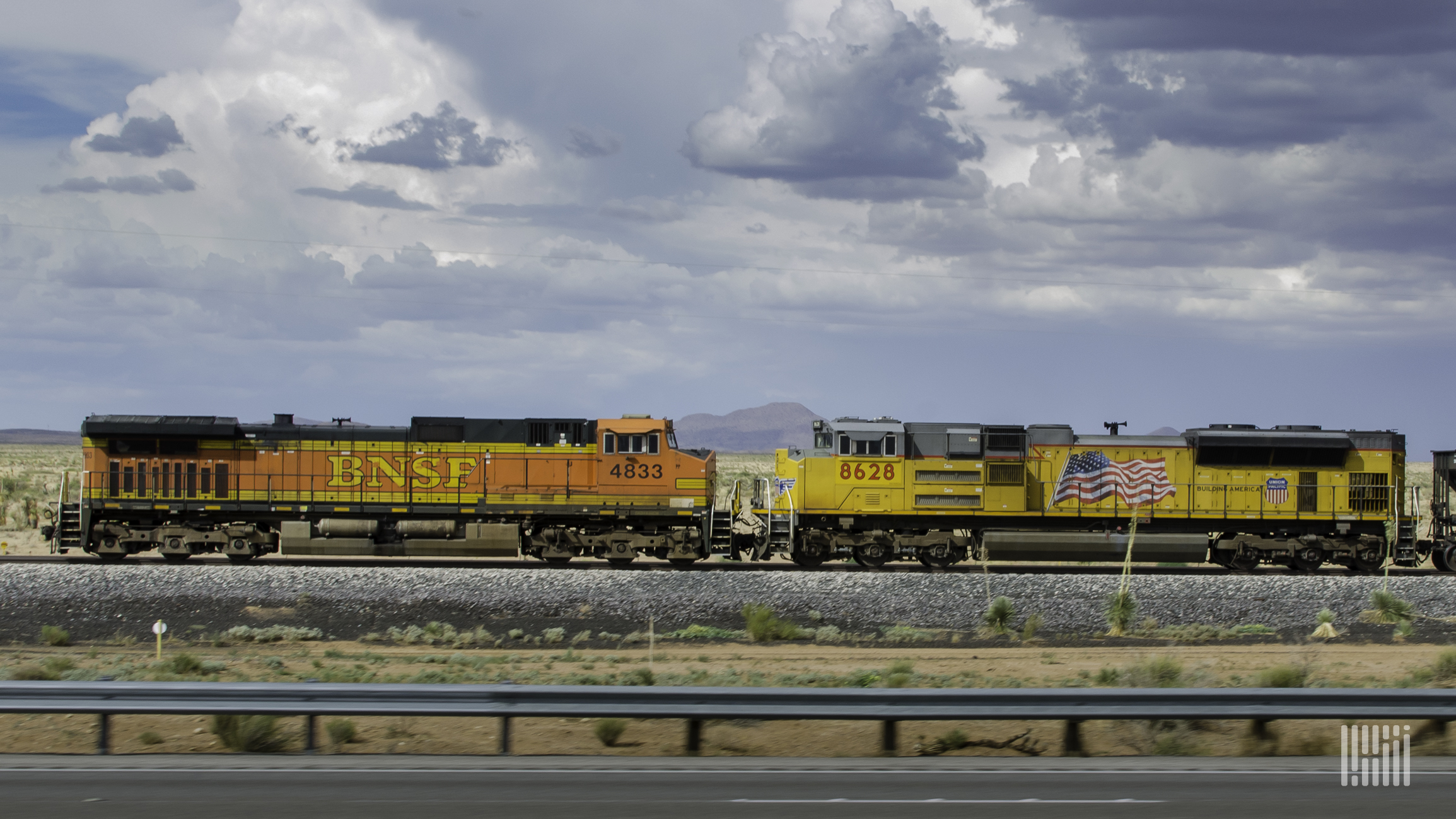 A photograph of a BNSF locomotive and a Union Pacific locomotive.