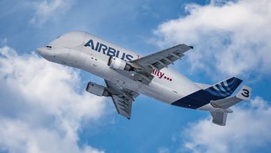Funky Airbus Beluga cargo jet soars into the air, view from below