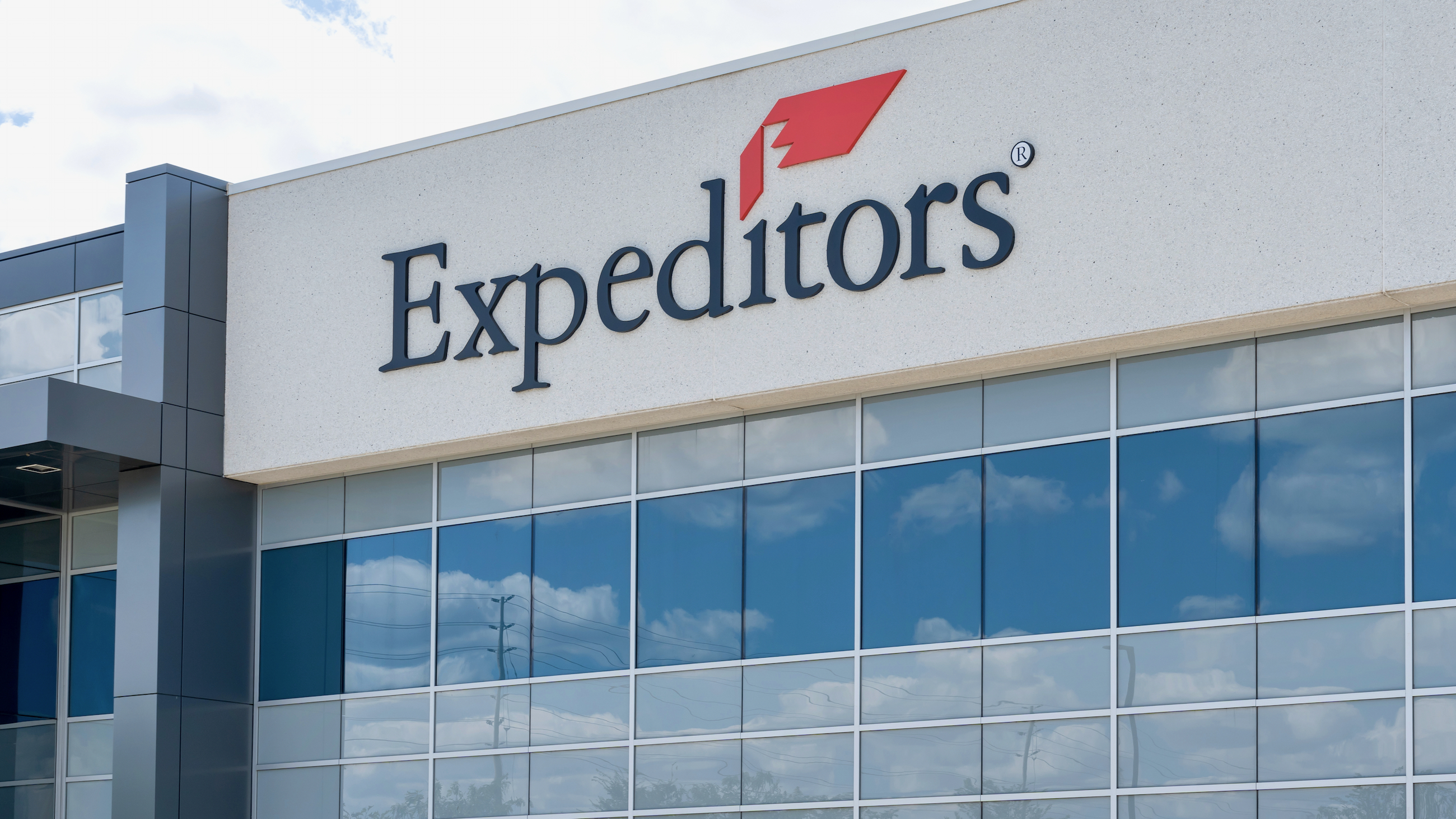 Close up of Expeditors sign on the building on Hogan Dr. in Mississauga, On, Canada. Expeditors is an American logistics and freight forwarding company.