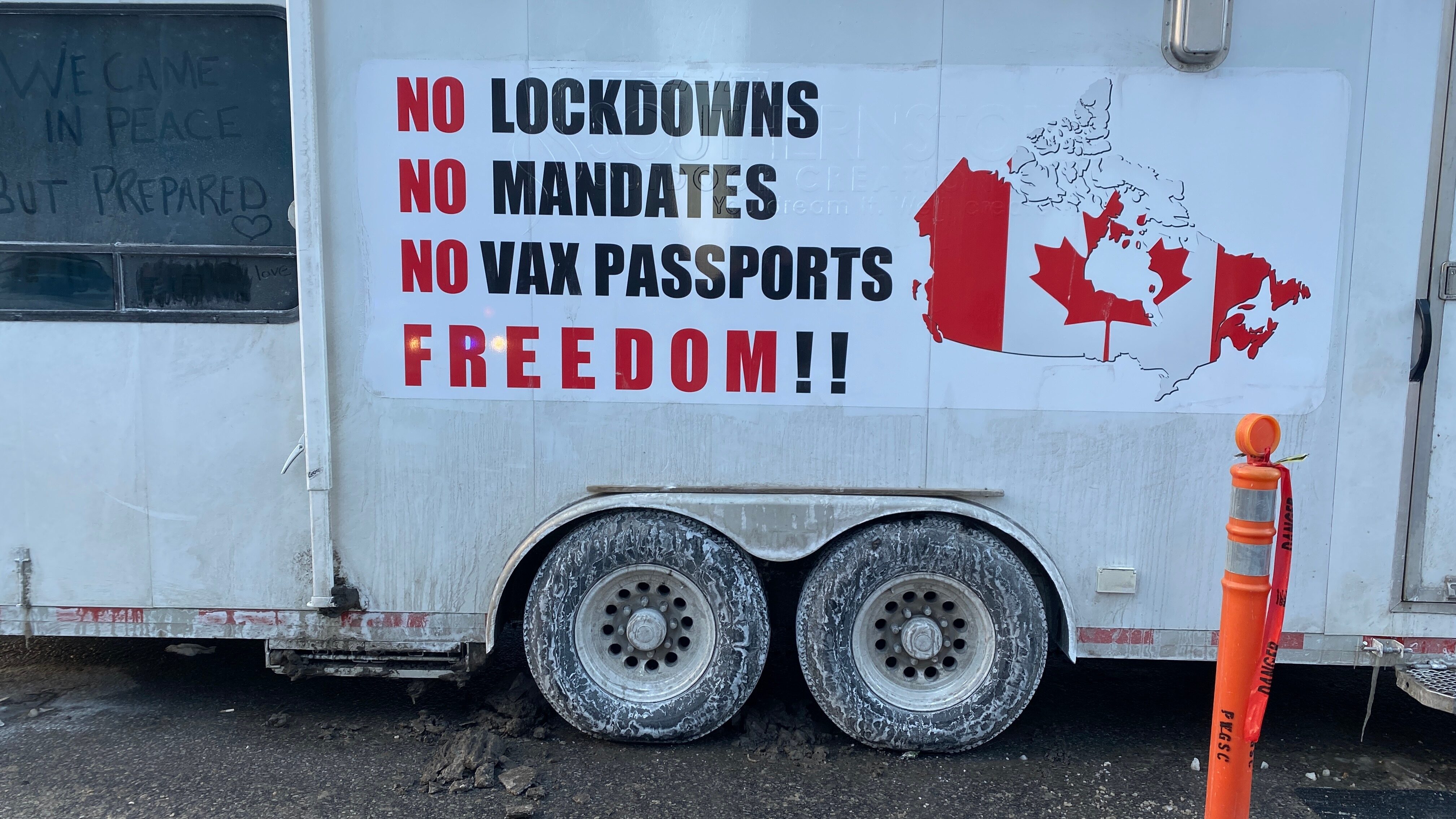 A sign showing protests over vaccine mandates in Canada.