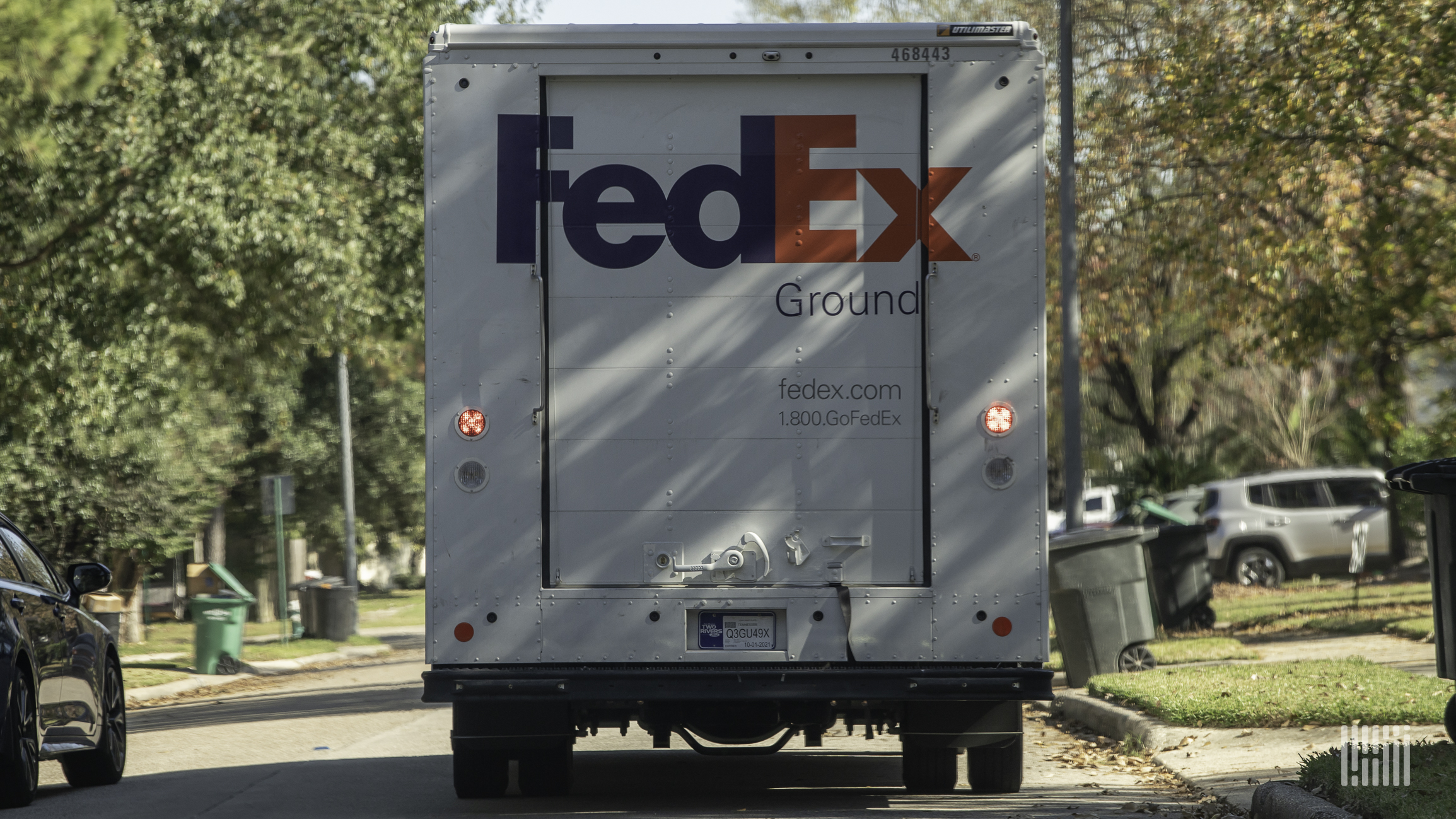A white FedEx truck seen from behind.