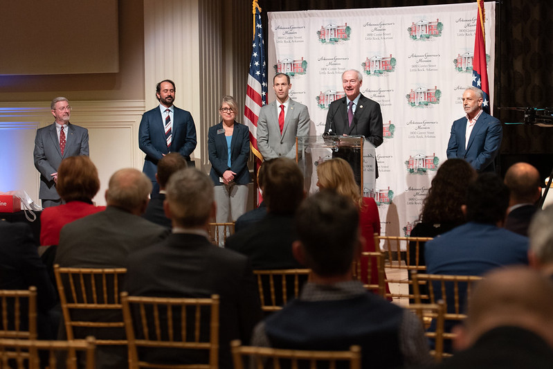 Arkansas Gov. Asa Hutchinson (at podium) announces the Arkansas Council on Future Mobility. Cyrus Sigari is seen standing second from left. (Photo: governor.arkansas.gov)  