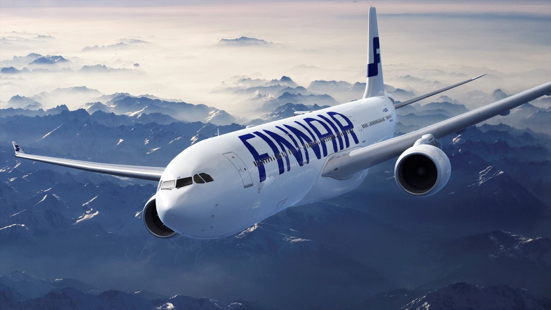 A white Finnair jet flying high above mountains, approaching camera.